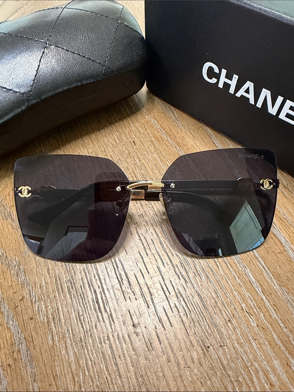 CHANEL Black Rimless Square Sunglasses with Gold Accents